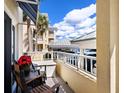 Relax on this condo's balcony with beautiful views of the property and the sky at 2424 Placida Rd # C104, Englewood, FL 34224
