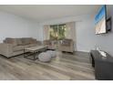 Inviting living room features contemporary furnishings and an open layout at 2625 Pine Lake Ter # B, Sarasota, FL 34237