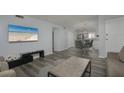 Open-concept living area seamlessly connects the living room to the dining area and kitchen at 2625 Pine Lake Ter # B, Sarasota, FL 34237