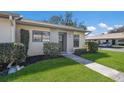Inviting single-story home with a well-manicured lawn and a paved walkway leading to the front door at 2720 60Th Avenue W Dr # D, Bradenton, FL 34207