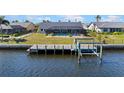 Waterfront home with a private pool and boat dock, offering easy access to the water at 4196 Eastlake Ct, Port Charlotte, FL 33948