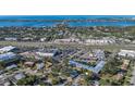 Panoramic aerial view showcasing the property's proximity to waterfront, shopping, and major roadways at 7272 Cass Cir, Sarasota, FL 34231