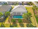 Aerial view of the pool, patio and backyard showcasing privacy and outdoor space at 7311 Summerland Cv, Bradenton, FL 34202