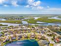 Bright aerial view of a waterfront home in a vibrant community with a lake view at 4809 11Th Avenue E Cir, Bradenton, FL 34208