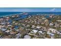 Waterfront property nestled among lush foliage, showcasing the stunning coastal community and tranquil waterways at 619 Buttonwood Dr, Longboat Key, FL 34228