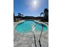 Enjoy this community pool with plenty of lounge chairs and beautiful landscaping to sit back and relax at 8949 Daybreak St, Sarasota, FL 34241