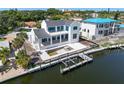 Waterfront home with a dock, boat lift, and pool under construction at 927 Contento St, Sarasota, FL 34242