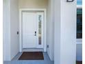 Stylish front door with sidelight, offers a bright and welcoming entrance at 2186 Yalta Ter, North Port, FL 34286