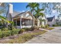 Charming home with lush landscaping, mature trees, and a welcoming screened-in porch at 4563 Whirlaway Dr # C, Sarasota, FL 34233