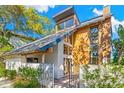 Beautiful exterior of a modern home featuring clean lines, multiple windows, and a well-maintained front yard at 5236 Siesta Cove Dr, Sarasota, FL 34242