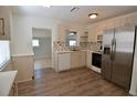 Modern kitchen with stainless steel appliances, light wood cabinets, and tiled backsplash at 321 40Th Street Nw Ct, Bradenton, FL 34209