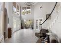 Grand living room featuring high ceilings, ample natural light, and neutral color palette at 3783 Beneva Oaks Blvd, Sarasota, FL 34238