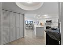 Bright, open kitchen featuring white cabinetry, stainless steel appliances, and seamless flow to the dining area at 5279 Isla Key S Blvd # 113, St Petersburg, FL 33715