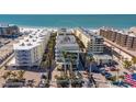 Stunning aerial view of the condo complex near a picturesque beach and ocean at 6512 Midnight Pass Rd # 206, Sarasota, FL 34242