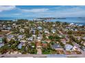 Aerial view of the community showcasing its proximity to the water and a nearby bridge at 691 Linley St, Longboat Key, FL 34228