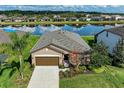 Beautiful home with lush landscaping and serene lake views in a desirable neighborhood at 9828 58Th E St, Parrish, FL 34219