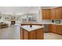 Kitchen view shows a center island, stainless steel appliances, and plenty of natural light at 14205 Nighthawk Ter, Lakewood Ranch, FL 34202