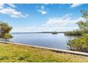 Scenic water view showing a tranquil bay with lush mangroves, blue sky, and a beautiful horizon at 1621 Memory Ln, Sarasota, FL 34231