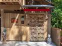 Unique carved wooden front door with artistic details, adding rustic charm at 2613 Temple St, Sarasota, FL 34239