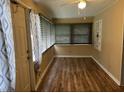 Inviting living room featuring wood floors, neutral walls, and abundant natural light from the window at 3308 W Dewey St, Tampa, FL 33607
