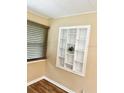 Close up of a unique built-in shelf and modern window with wood blinds and a modern aesthetic at 3308 W Dewey St, Tampa, FL 33607