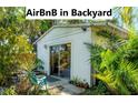 Charming backyard rental cottage surrounded by tropical plants and lush landscaping, great for extra income! at 4062 S Shade Ave, Sarasota, FL 34231