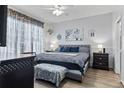 Spacious main bedroom with accent wall and large comfortable king bed at 4630 56Th E Dr, Bradenton, FL 34203