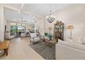 Bright and open living room with contemporary furnishings and seamless access to outdoor patio at 4670 Antrim Dr, Sarasota, FL 34240