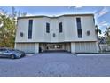 Exterior shot of building with covered parking and sleek architectural details at 5611 Gulf Of Mexico Dr # 5, Longboat Key, FL 34228