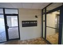 Building lobby featuring mailboxes, tile flooring, and secure access to elevator at 5611 Gulf Of Mexico Dr # 5, Longboat Key, FL 34228