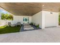 Charming driveway with pavers, rocks, and well maintained yard at 870 N Shore Dr, Anna Maria, FL 34216