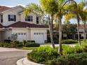 Charming townhome with lush landscaping, attached two-car garage and beautiful curb appeal at 2345 Felicity Pl, North Port, FL 34289