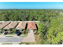 A picturesque aerial view of the neighborhood, showcasing lush greenery and well-maintained properties at 701 Maraviya Blvd, Nokomis, FL 34275