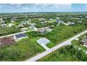Aerial view showing the home's location in a residential neighborhood at 9245 Zorn St, Port Charlotte, FL 33981