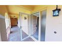 Open door revealing tiled entry and hallway at 1 Colony Point Dr # 5C, Punta Gorda, FL 33950