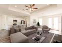 Open living space with L-shaped sofa and modern decor at 1309 Nackman Rd, North Port, FL 34288