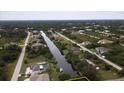 Residential lot on a canal with nearby houses at 9453 Zorn St, Port Charlotte, FL 33981