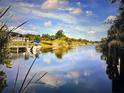 Peaceful waterfront property with a boat and dock at 9453 Zorn St, Port Charlotte, FL 33981