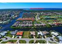Aerial view of waterfront home with canal access and community at 1429 Blue Jay Ct, Punta Gorda, FL 33950