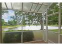 Enjoy serene lake views from this screened porch at 2081 Lynx Run, North Port, FL 34288