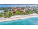 Aerial view showcasing beachfront location and community at 8750 Midnight Pass Rd # 202, Sarasota, FL 34242