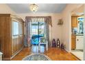 Charming dining area with wood floors and access to a patio at 2132 Abscott St, Port Charlotte, FL 33952