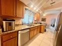 Bright kitchen features granite countertops and modern appliances at 2132 Abscott St, Port Charlotte, FL 33952