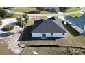 Aerial view showcasing the home's backyard and surrounding landscape at 26345 Trinilas Dr, Punta Gorda, FL 33983