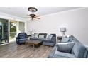 Spacious living room featuring hardwood floors and ample natural light at 17258 Acapulco Rd # 122, Punta Gorda, FL 33955