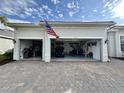 Three car garage with golf cart and storage at 25133 Longmeadow Dr, Punta Gorda, FL 33955