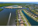 Stunning aerial view of waterfront homes with private docks and boat lift in a picturesque coastal community at 15240 Spanish Point Dr, Port Charlotte, FL 33981