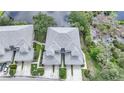 Aerial perspective showcasing the community's location near a lake at 3332 Grand Vista Ct # 101, Port Charlotte, FL 33953