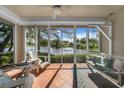Relaxing screened porch overlooking a tranquil lake at 3332 Grand Vista Ct # 101, Port Charlotte, FL 33953