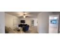 Bright living room with tile floors and comfy armchairs at 3100 Harbor Blvd # 116, Port Charlotte, FL 33952